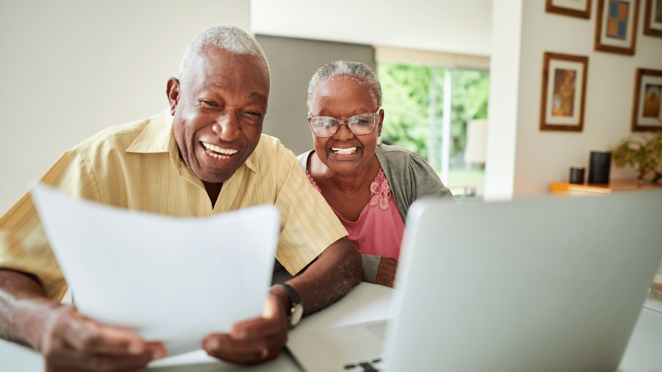 Retired couple looking at how well their retirement annuities are performing with Infinite Retirement Solutions.